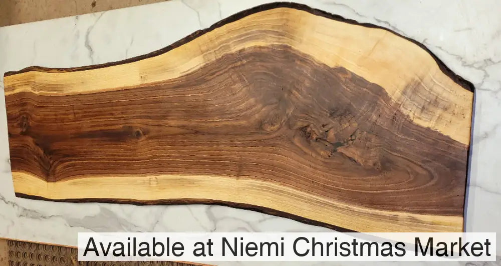 A wonderful curve art way down the grazing board with exciting natural patterns in the dark sections and light outer strip with black bark