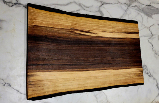 Wide Enough- A Black Walnut Grazing Board with dark middle section, light towards the edges, and dark black bark